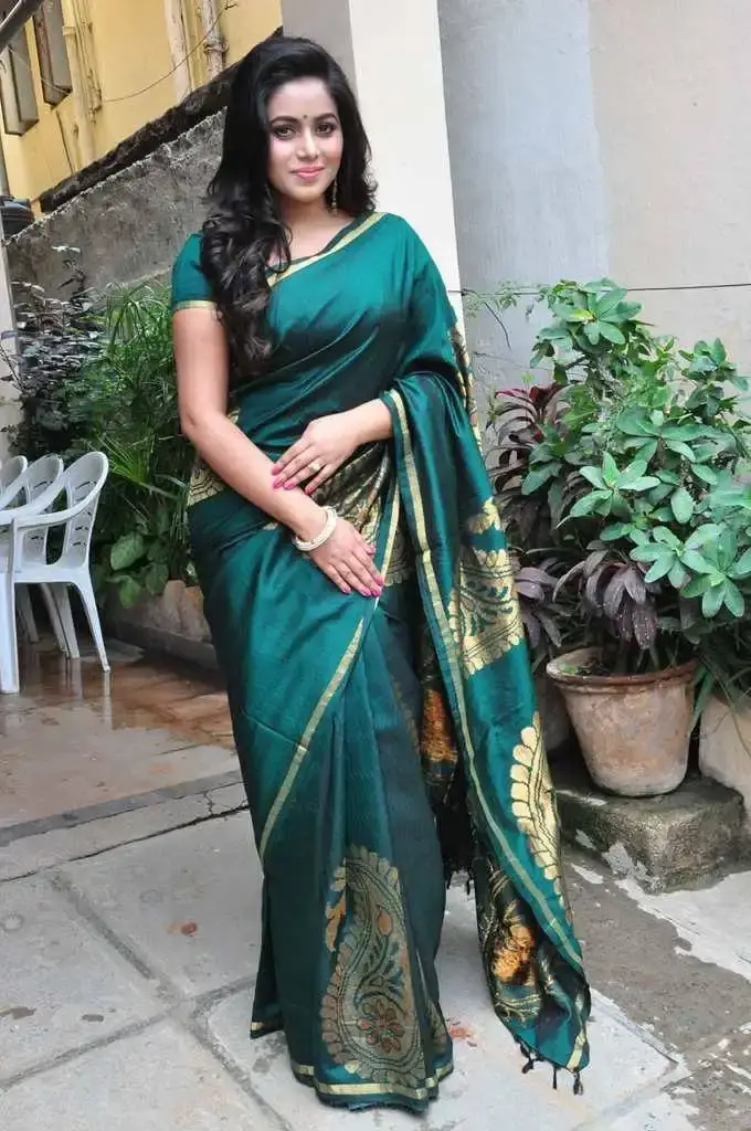 Indian Queen Poorna In Green Saree At Fashion Studio